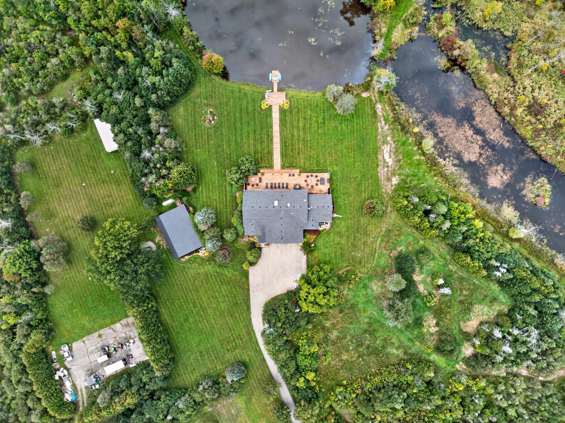 Top-down view of the boardwalk, dock and pond